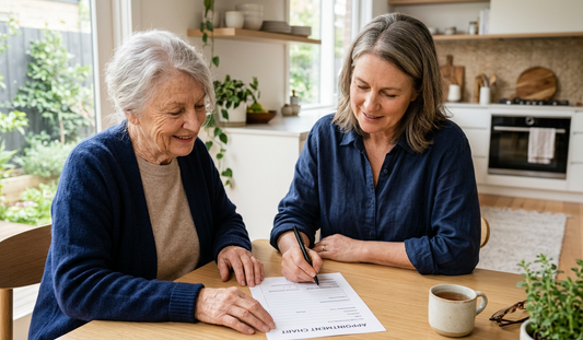 Older woman and younger woman reviewing an appointment chart in preparation for a doctor’s appointment.