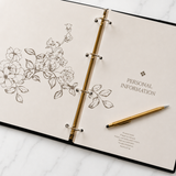 My Medical Folder personal information section open to the personal details page with floral design, gold ring binder and pen, helping organise important medical records and emergency information in Australia.